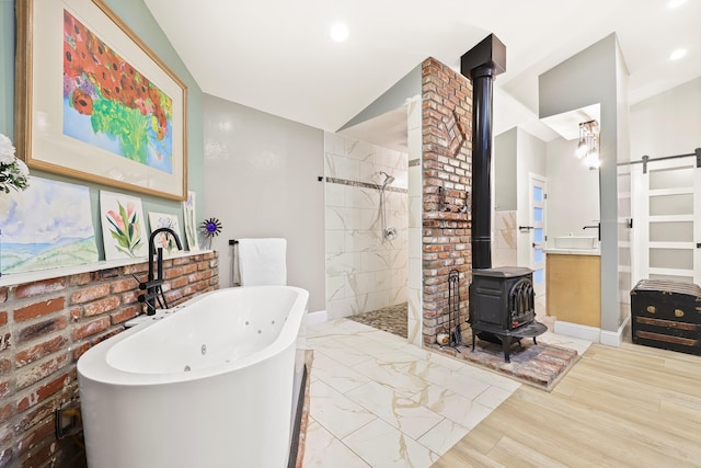 40005 W 92nd St Unit W, Leona Valley, CA 93551 - full bath featuring a wood stove, lofted ceiling, a freestanding tub, walk in shower, and vanity