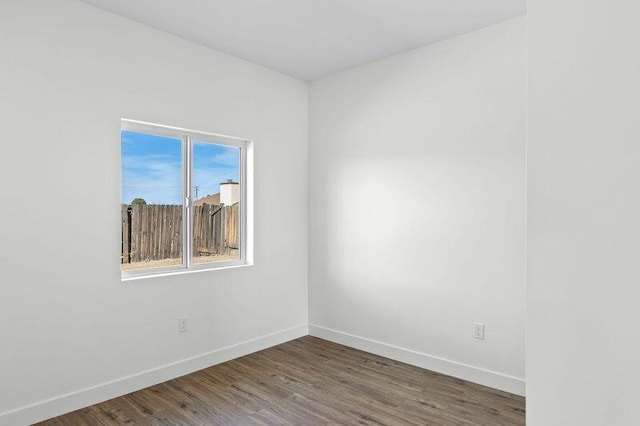 empty room featuring dark hardwood / wood-style floors