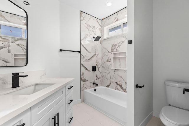 full bathroom with tile patterned floors, tiled shower / bath combo, toilet, and vanity