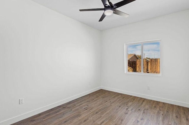 empty room featuring ceiling fan and hardwood / wood-style floors