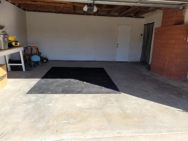 ranch-style house featuring a garage