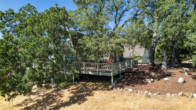 view of yard featuring a wooden deck