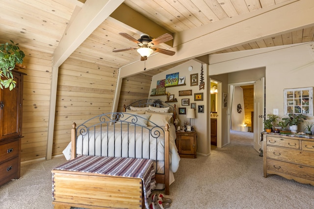 carpeted bedroom featuring lofted ceiling with beams, ceiling fan, wooden ceiling, and wooden walls