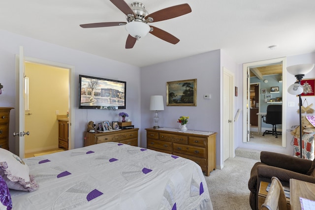 bedroom featuring ceiling fan, ensuite bathroom, and light carpet