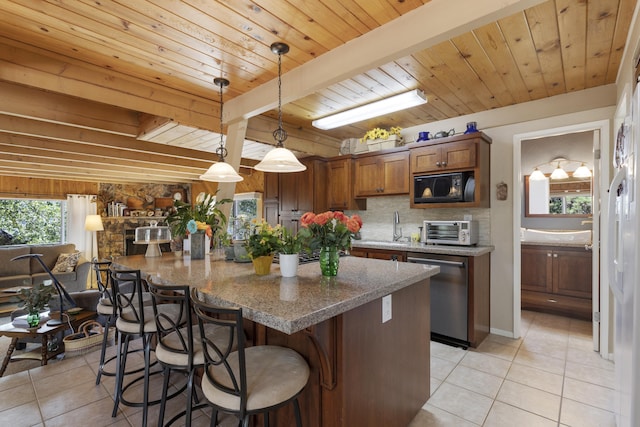 kitchen featuring wood ceiling, hanging light fixtures, beam ceiling, black microwave, and stainless steel dishwasher