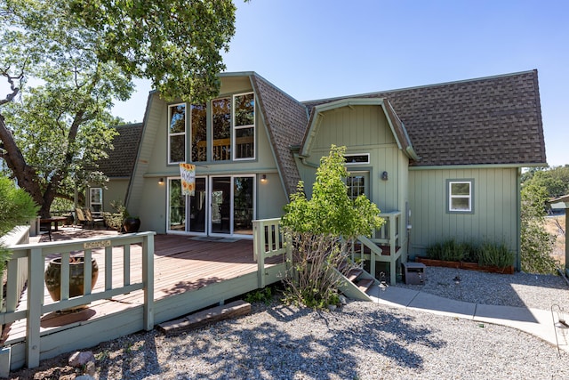 back of house with a wooden deck