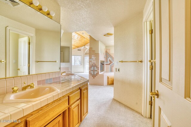 9250 Elizabeth Lake Rd, Leona Valley, CA 93551 - bathroom with double vanity and a textured ceiling