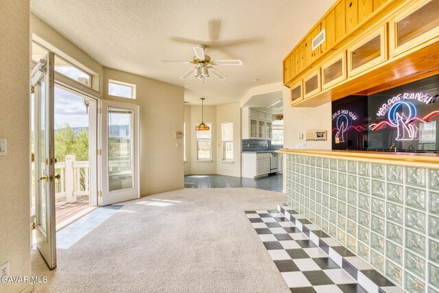 9250 Elizabeth Lake Rd, Leona Valley, CA 93551 - kitchen featuring ceiling fan, dark carpet, and french doors