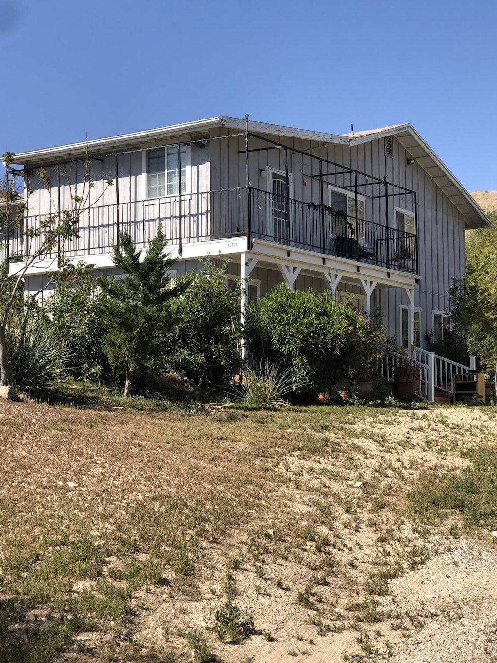 15771 Baker Canyon Rd, Santa Clarita, CA 91390 - back of property with a balcony and board and batten siding