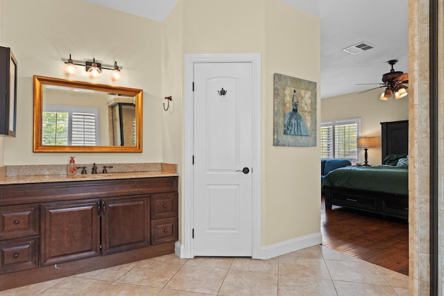 23600 Dart Dr, Tehachapi, CA 93561 - ensuite bathroom featuring tile patterned flooring, ceiling fan, baseboards, and vanity