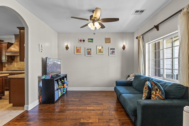 23600 Dart Dr, Tehachapi, CA 93561 - living area featuring arched walkways, a ceiling fan, hardwood / wood-style floors, and baseboards