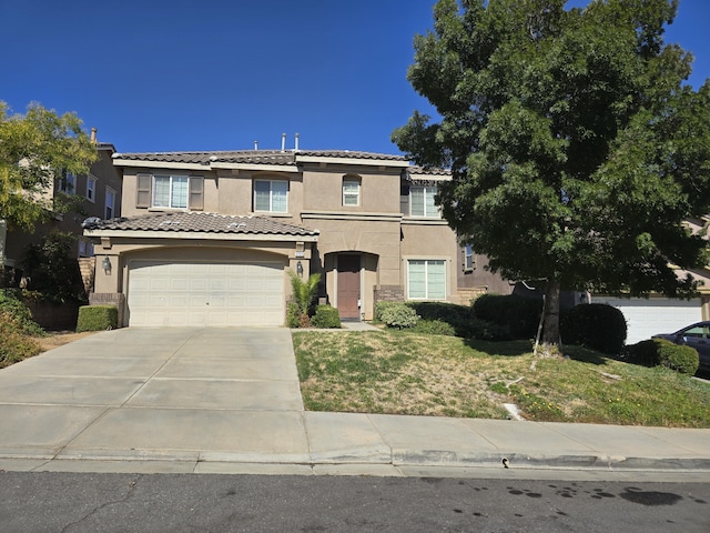 37515 Ruby Red Ln, Palmdale, CA 93551 - view of front facade featuring stucco siding, concrete driveway, a garage, and stone siding