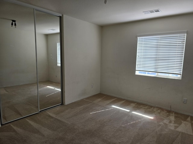 37515 Ruby Red Ln, Palmdale, CA 93551 - unfurnished bedroom with carpet floors and a closet
