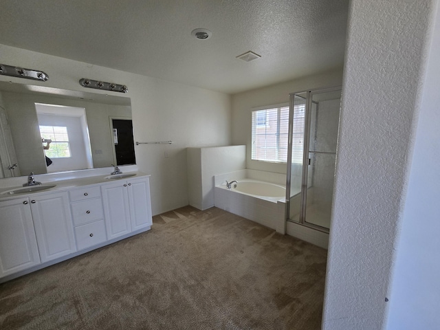 37515 Ruby Red Ln, Palmdale, CA 93551 - bathroom with double vanity, a bath, a shower stall, and a textured ceiling