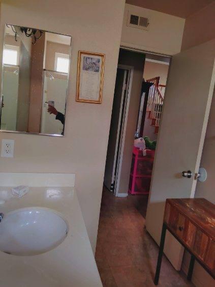 bathroom with tile patterned floors and sink