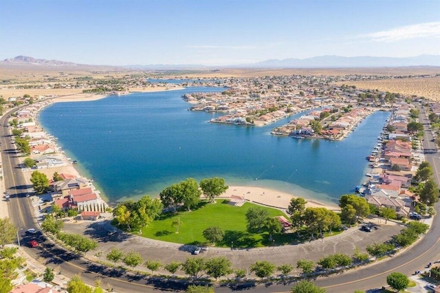 bird's eye view with a water and mountain view