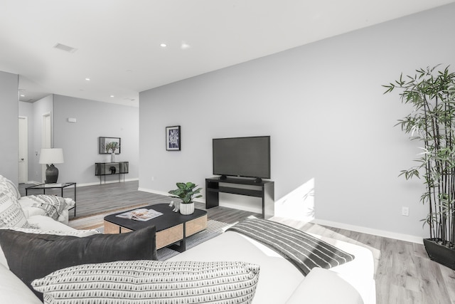 living room with light hardwood / wood-style floors