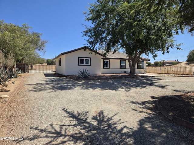 4102 Pearblossom Hwy, Palmdale, CA 93552 - view of front of property featuring stucco siding and driveway