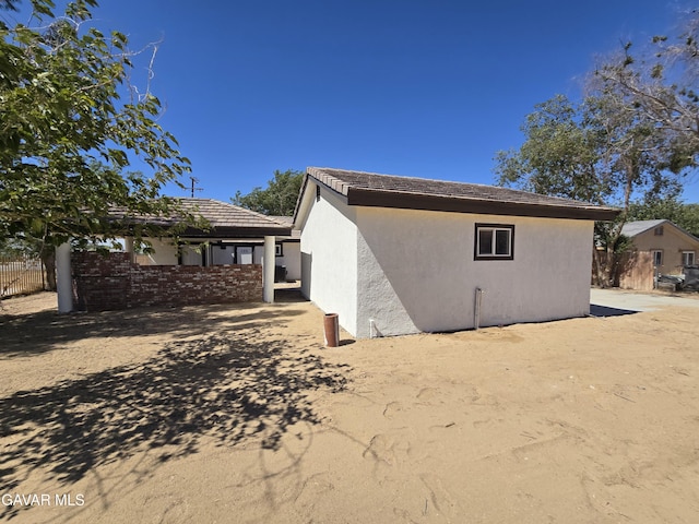 4102 Pearblossom Hwy, Palmdale, CA 93552 - back of house featuring stucco siding