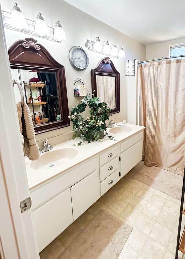 bathroom with vanity and curtained shower