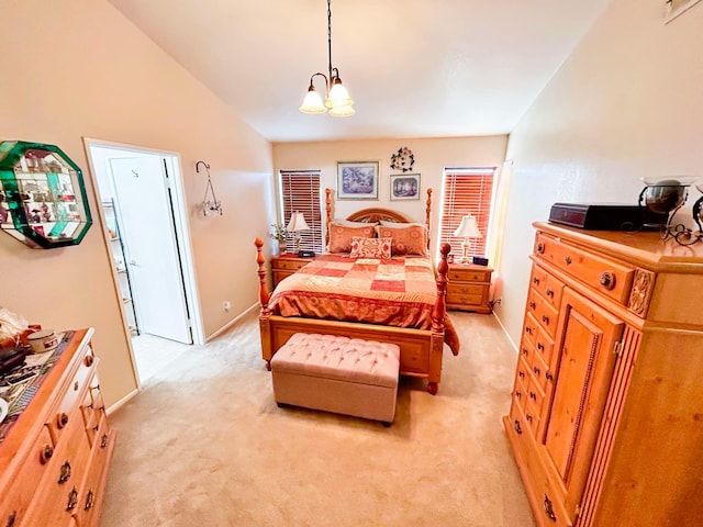 carpeted bedroom with a chandelier