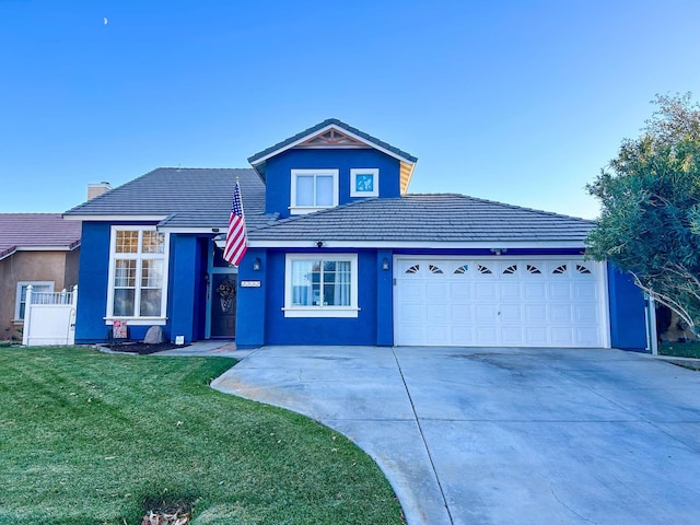 view of front of property featuring a garage and a front lawn