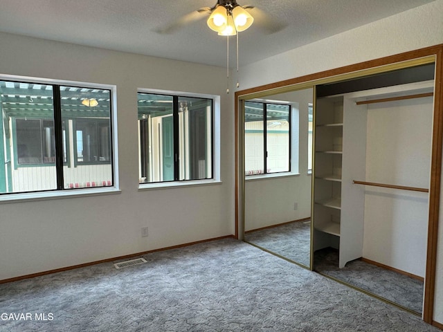 28714 Cruthers Creek Rd, Pearblossom, CA 93553 - unfurnished bedroom with carpet floors, a closet, and ceiling fan