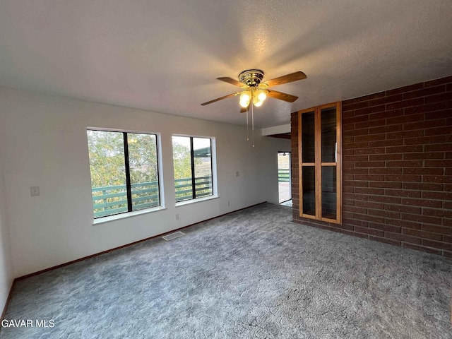 28714 Cruthers Creek Rd, Pearblossom, CA 93553 - unfurnished room with ceiling fan, carpet flooring, and a textured ceiling