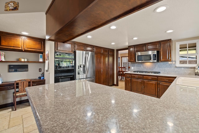 436 Fairway Dr, Palmdale, CA 93551 - kitchen featuring stainless steel appliances, tasteful backsplash, recessed lighting, a sink, and light stone countertops