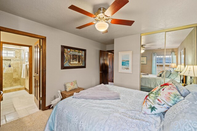 436 Fairway Dr, Palmdale, CA 93551 - bedroom with a closet, baseboards, a ceiling fan, a textured ceiling, and light colored carpet