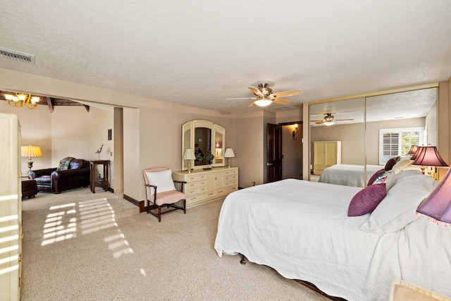 436 Fairway Dr, Palmdale, CA 93551 - carpeted bedroom featuring a textured ceiling, a ceiling fan, baseboards, and a chandelier