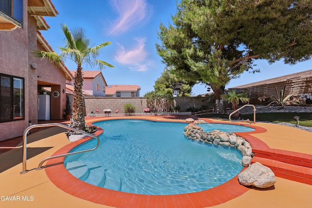 38100 San Mateo Ave, Palmdale, CA 93551 - view of pool featuring a fenced backyard, a patio area, and a hot tub