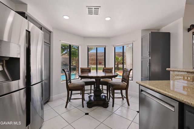 38100 San Mateo Ave, Palmdale, CA 93551 - dining area with recessed lighting and light tile patterned floors