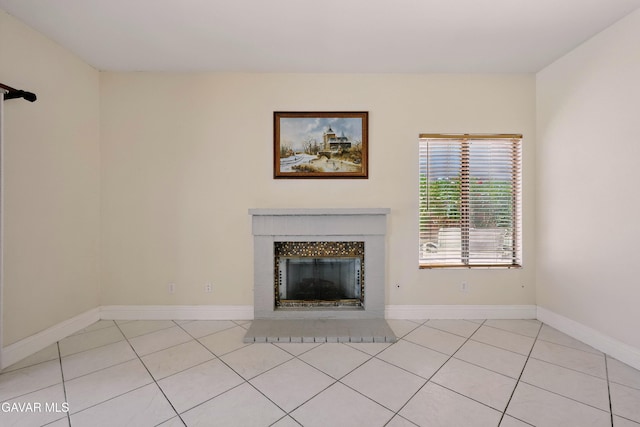 38100 San Mateo Ave, Palmdale, CA 93551 - unfurnished living room with light tile patterned floors and a fireplace with flush hearth