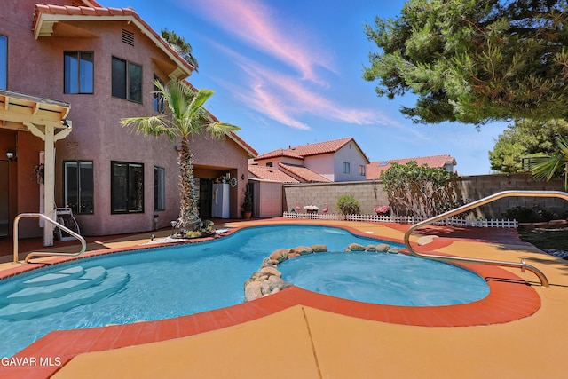 38100 San Mateo Ave, Palmdale, CA 93551 - view of swimming pool with a fenced backyard, a pool with connected hot tub, and a patio
