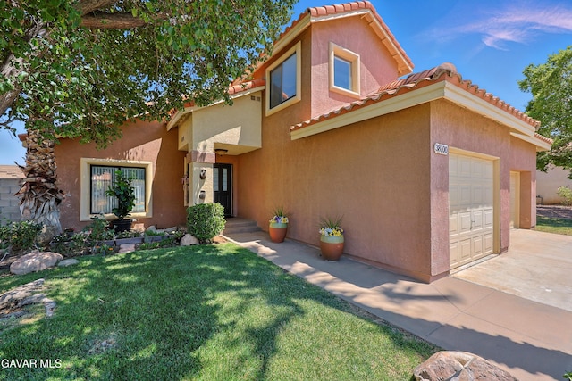 38100 San Mateo Ave, Palmdale, CA 93551 - view of front of house featuring stucco siding, concrete driveway, a front lawn, a tile roof, and a garage