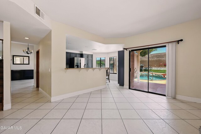 38100 San Mateo Ave, Palmdale, CA 93551 - unfurnished room with light tile patterned floors, a chandelier, and recessed lighting