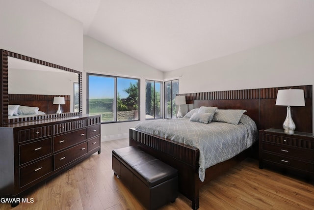 38100 San Mateo Ave, Palmdale, CA 93551 - bedroom featuring wood finished floors and high vaulted ceiling