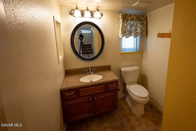 4722 Sungate Dr, Palmdale, CA 93551 - bathroom with tile patterned flooring, vanity, and a textured wall