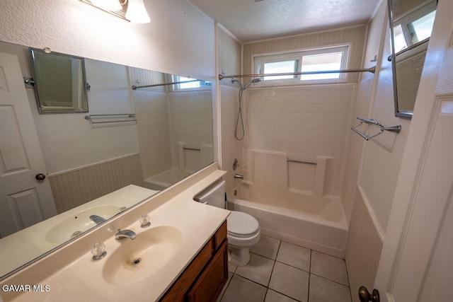 4722 Sungate Dr, Palmdale, CA 93551 - full bath with tub / shower combination, vanity, tile patterned flooring, a textured ceiling, and a wainscoted wall