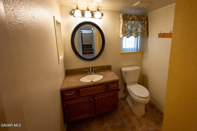 4722 Sungate Dr, Palmdale, CA 93551 - half bathroom featuring tile patterned floors, vanity, and a textured wall