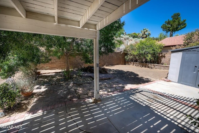 4722 Sungate Dr, Palmdale, CA 93551 - fenced backyard featuring a patio and a storage shed