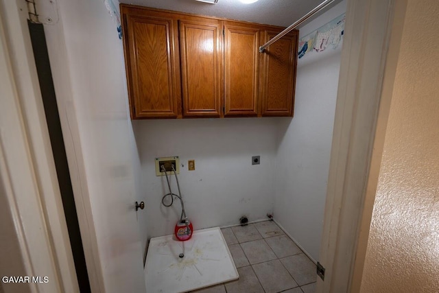 4722 Sungate Dr, Palmdale, CA 93551 - laundry room featuring washer hookup, cabinet space, electric dryer hookup, and light tile patterned floors