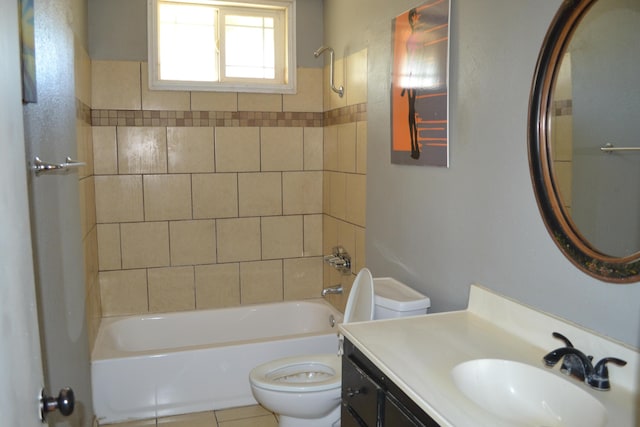 full bathroom with vanity, tile patterned floors, tiled shower / bath combo, and toilet