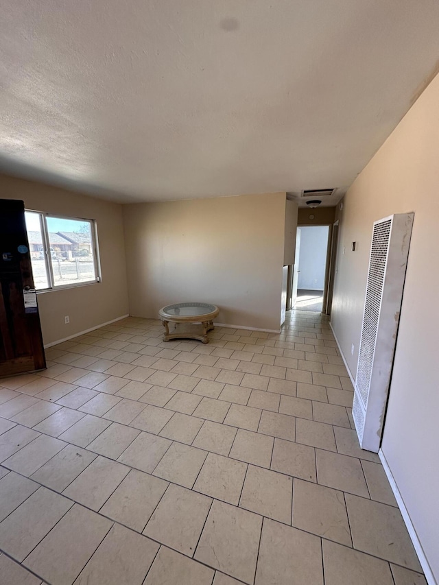 unfurnished room featuring light tile patterned flooring