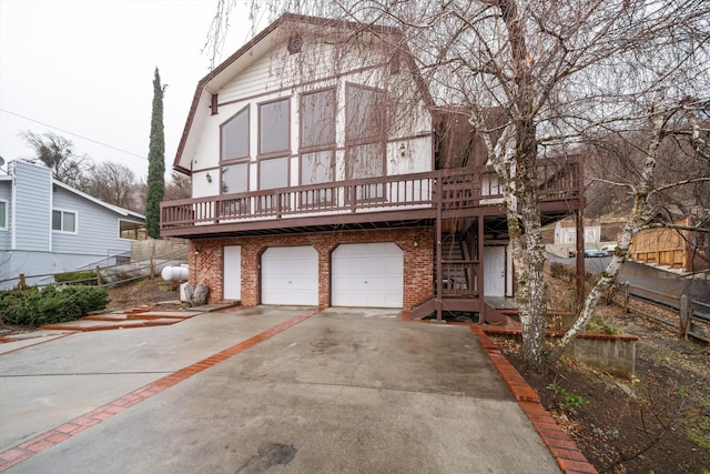 view of front of home featuring a garage and a deck