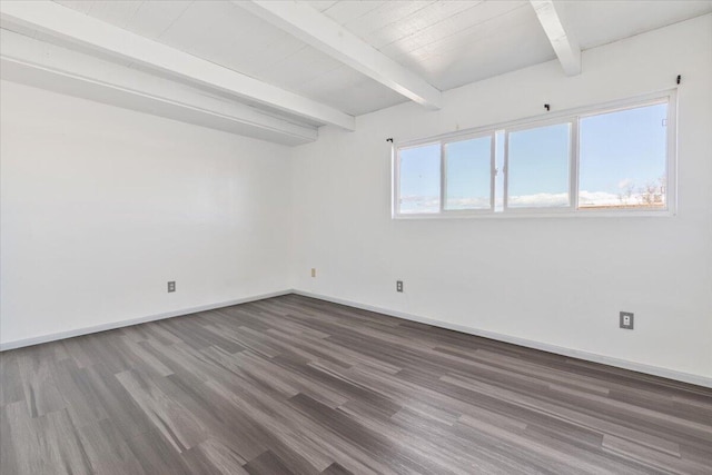 unfurnished room featuring baseboards, beam ceiling, and wood finished floors