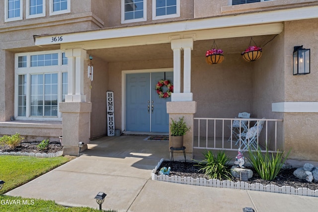 3616 Glenridge Ave, Rosamond, CA 93560 - view of exterior entry featuring a porch and stucco siding
