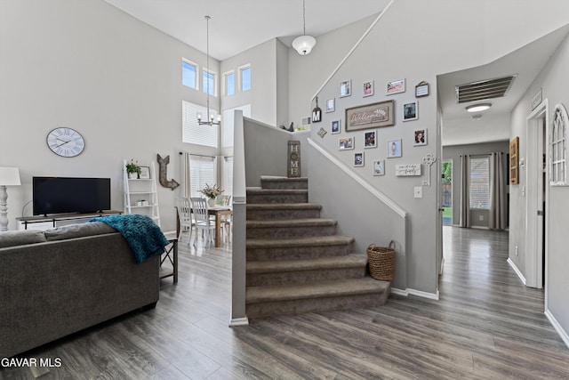 3616 Glenridge Ave, Rosamond, CA 93560 - living area with dark wood-style flooring, stairway, healthy amount of natural light, and a high ceiling