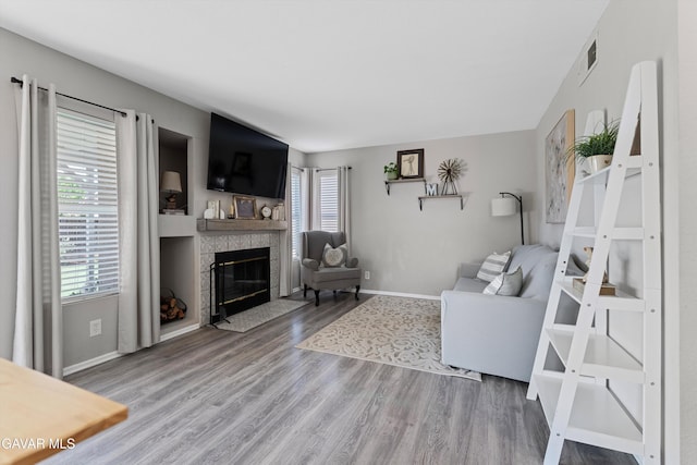 3616 Glenridge Ave, Rosamond, CA 93560 - living room featuring wood finished floors and a fireplace